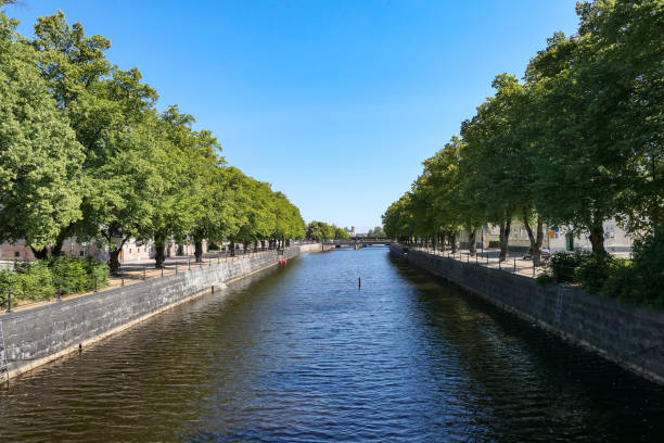 istock Scenic view of canal against clear sky 1495970592