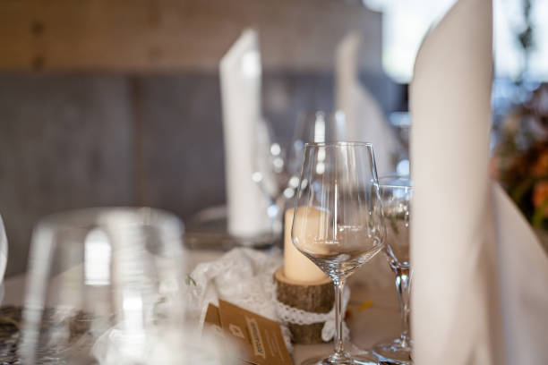 istock Decorated Gala dinner table with wine glasses and decorative napkins for a wedding 1495971585