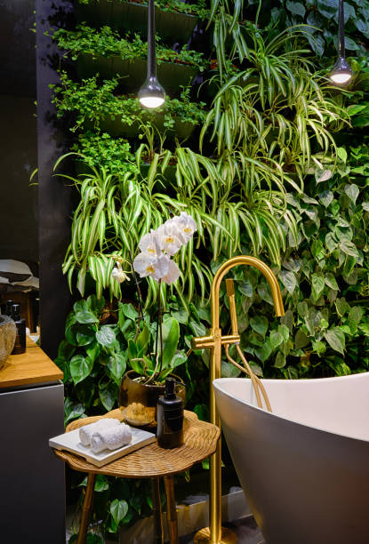 istock Luxury bathroom interior in spa with vertical garden, bath in modern beauty salon. 1495980381