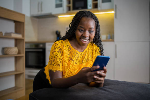 istock Happy young woman using phone 1495981309