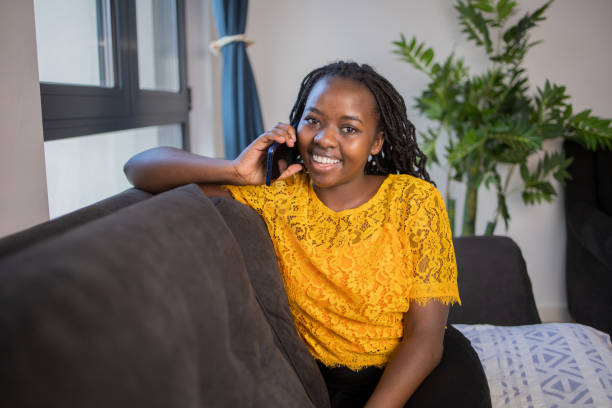 istock Happy young woman using phone 1495981378