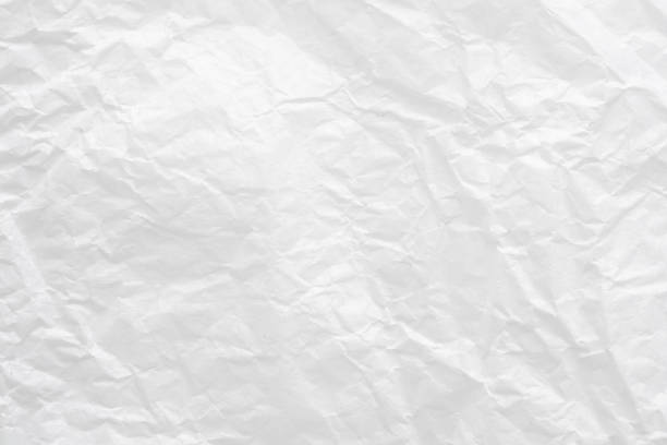 istock Abstract white crumpled and creased recycle paper texture background 1495981676