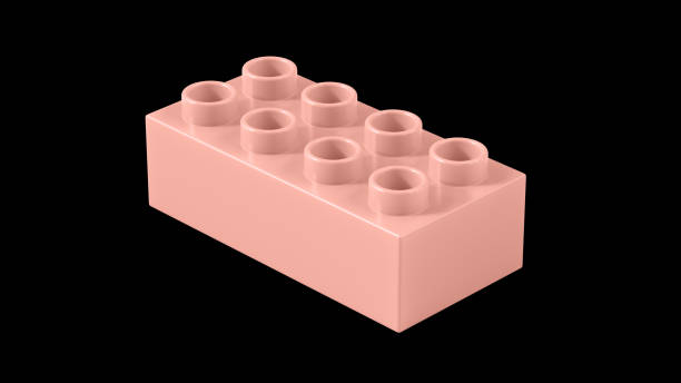 istock Peach Pearl Plastic Toy Block Isolated on a Black Background. 1495983372