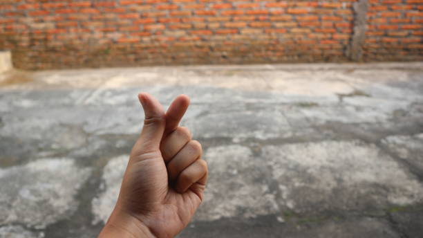 istock male hands in sarangheo pose 1495997118