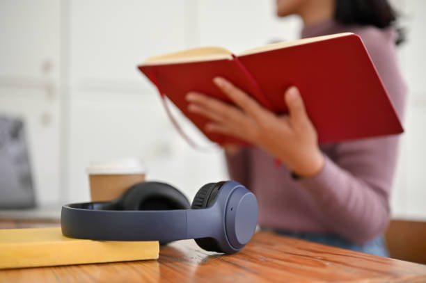 istock Close-up image of modern wireless headphones on a table 1496002935