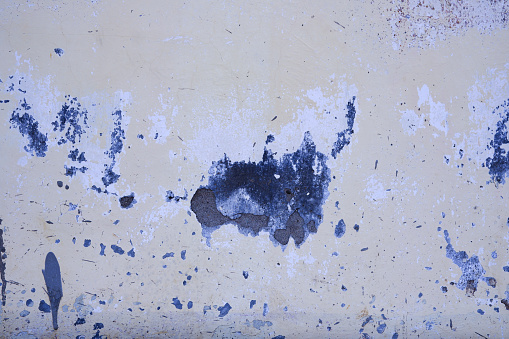 abstract white cement wall background broken and peeling off