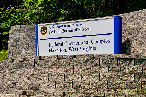 Hazelton, West Virginia, USA - June 4, 2023: Entrance sign to the Federal Correctional Complex (FCC), operated by the U.S. Department of Justice’s Federal Bureau of Prisons, that includes both the  United States Penitentiary, Hazelton (USP Hazelton) and the Federal Correctional Institution, Hazelton (FCI Hazelton).