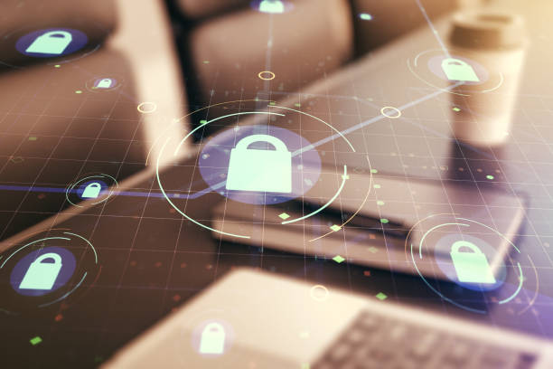 istock Double exposure of creative lock hologram with chip on laptop background. Information security concept 1496020710