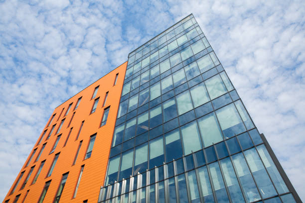 istock Modern office building with glass facade and blue sky. 1496021417