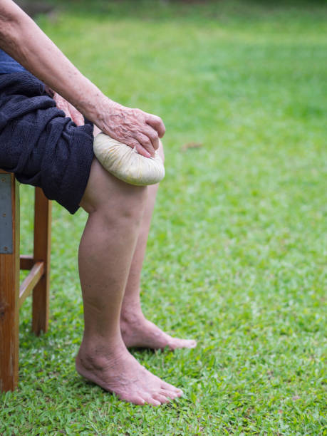 istock enior woman use thai herbal compress ball to knee 1496025005