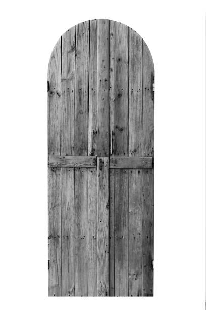 istock black and white Wooden door isolate on white 1496026904
