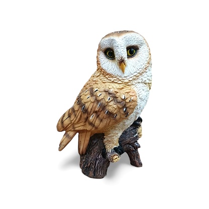 A figurine of an owl on a white background