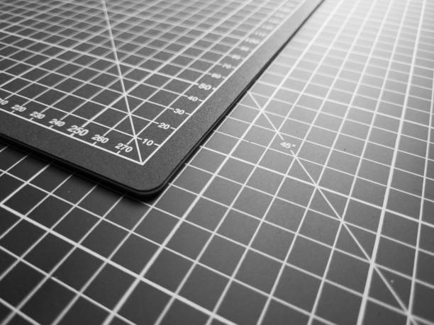 istock Black and white mat for cutting with grid and numbers, macro. 1496030007
