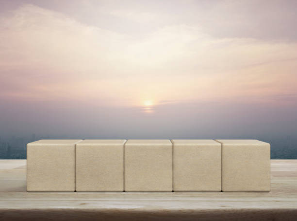 istock Five wood block cubes on wooden table 1496032431