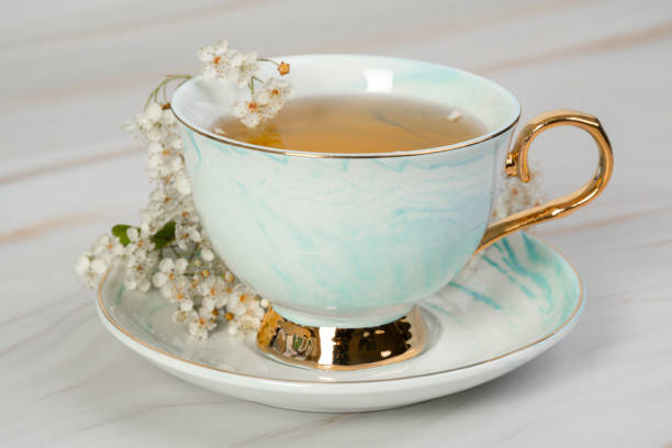 istock Pretty porcelain tea cup wiyh flowers 1496032759