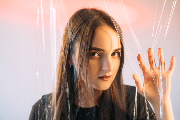 istock Psychic medium portrait mysterious woman face hand 1496034814