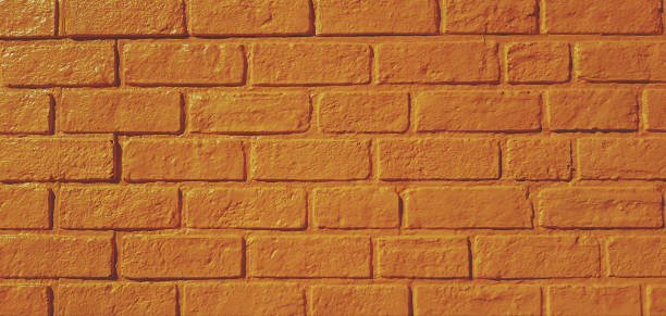 istock Pattern yellow brick wall painted for background in vintage tone. 1496035394