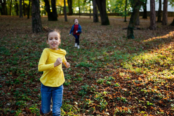 istock Children running in autumn park 1496036426