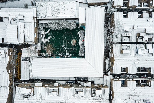 An aerial shot of buildings covered in snow in Wuhan, China.