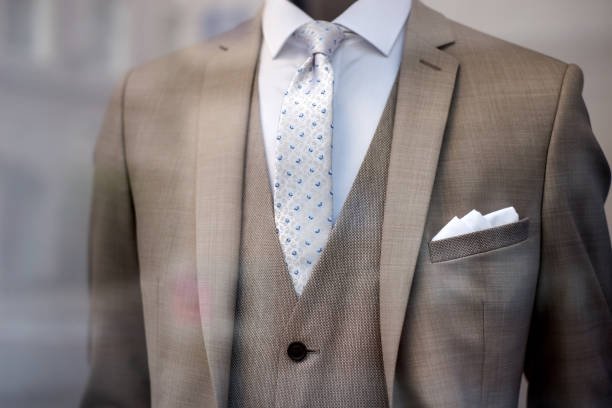 istock brown wedding suit on mannequin in wedding store showroom 1496037715