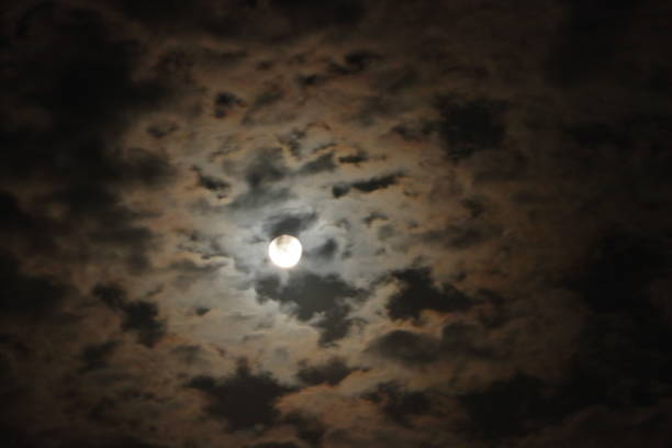 istock Full moon with clouds in the night sky. Beautiful Night View. 1496041022