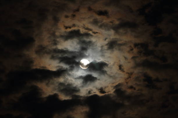 istock Full moon with clouds in the night sky. Beautiful Night View. 1496041084