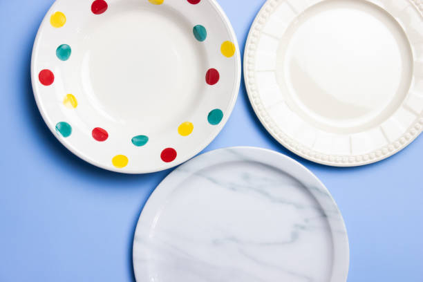 istock Empty plates with dots, marble and white over the blue background. 1496041675