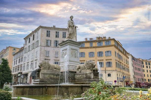 Corse, ancient colorful houses in Ajaccio, in the historic center, with a fountain