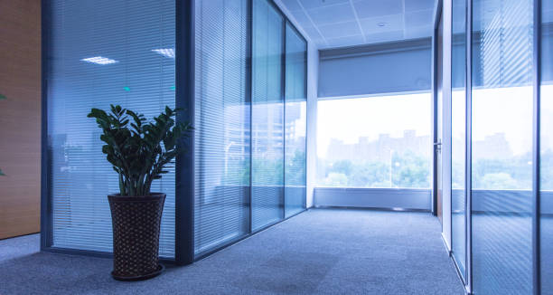 istock Corridor with glass walls in office interior 1496045060