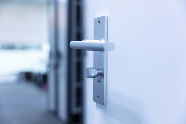 istock Opened door with metal lock and door handle 1496045196