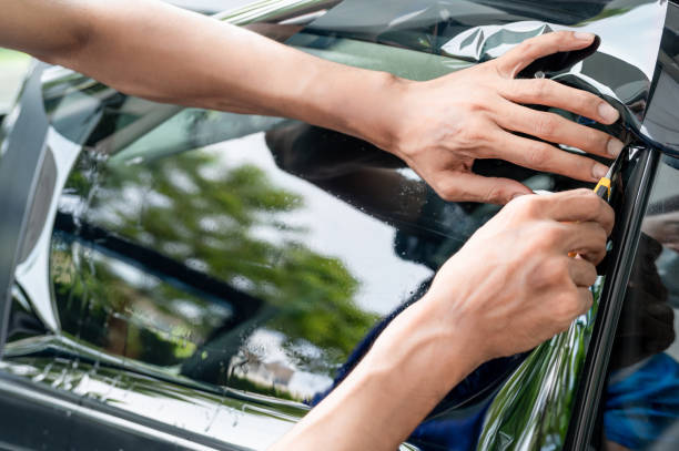 istock Car side window film removal and tinting installation 1496045423