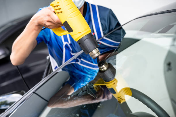 istock Car front windscreen film removal and tinting installation 1496045435