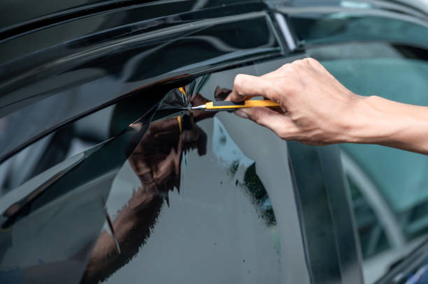 istock Car side window film removal and tinting installation 1496045460