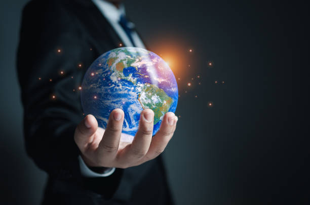istock Businessman holding a model globe. concept of network communication. information network concept. element from NASA. 1496048057