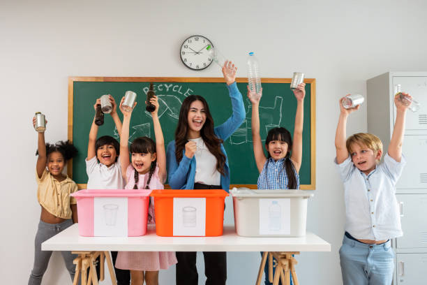 istock Group of student learn with teacher in classroom at elementary school. Attractive beautiful female instructor master explain and educate young children with happiness and fun activity at kindergarten. 1496049633