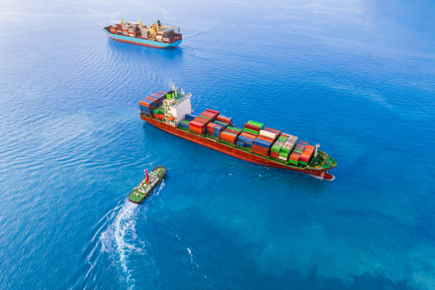 istock Aerial front view container ship in import export and business logistic, By crane, Trade Port, Shipping cargo to harbor, International transportation, Business logistics. 1496049932