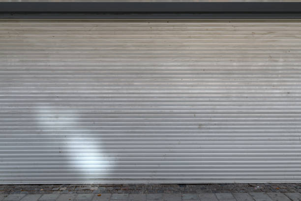 Exterior roller aluminum shutters on garage door as background