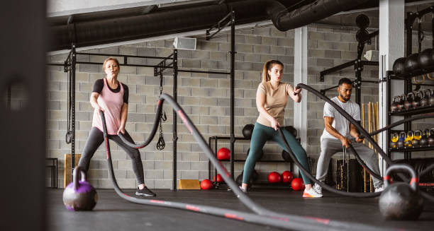 istock Small Group of People Exercising at a Gym 1496054661