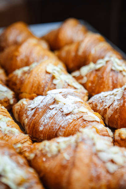 istock Sprinkle the finished croissants on a baking sheet with almond flakes 1496059219