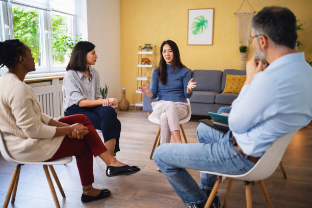 istock During multiracial group therapy, woman Japanese ethnicity, sharing her thoughts and emotions 1496059223