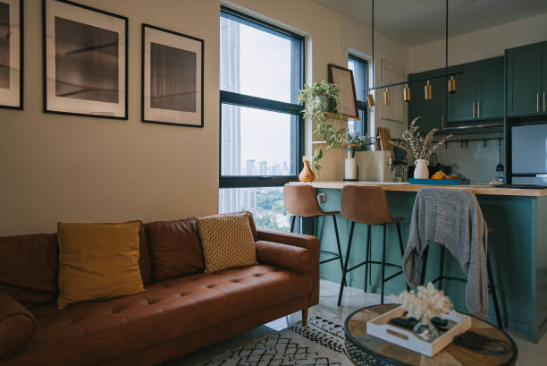 istock Cozy small studio apartment with sofa and kitchen island 1496059399