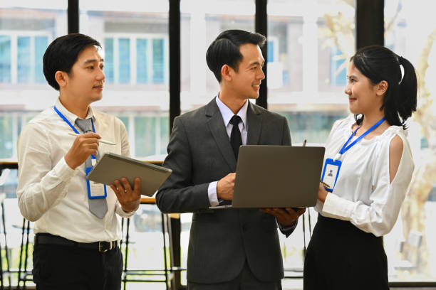 istock Successful business team sharing ideas, discussing business strategy information at modern office. 1496059459