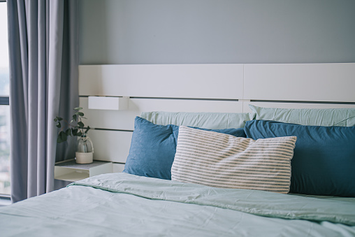 cozy bedroom with pillow and bedsheet