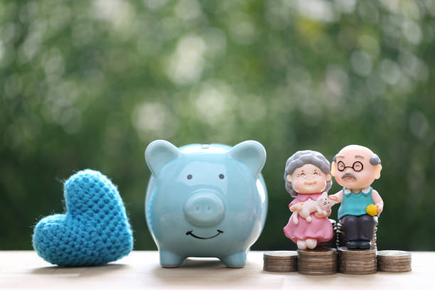 Love couple senior and piggy bank on natural green background, Save money for prepare in future and pension retirement concept Love couple senior and piggy bank on natural green background, Save money for prepare in future and pension retirement concept savings account stock pictures, royalty-free photos & images