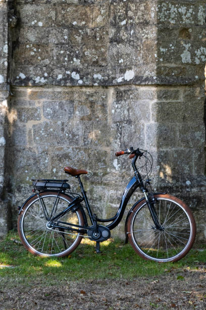 istock Retro bicycle by and old church 1496061182