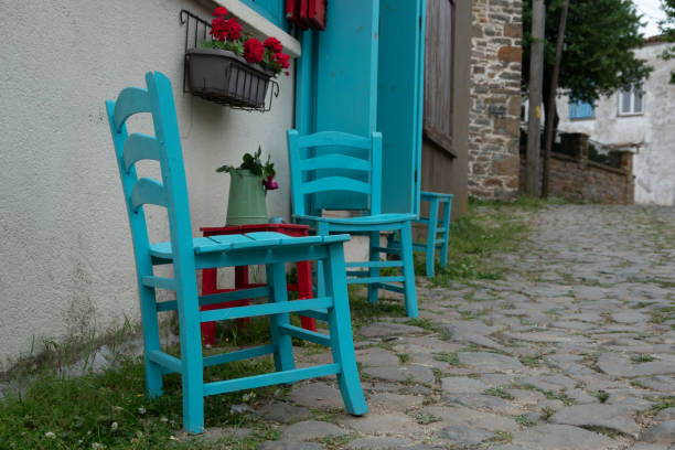 istock Blue chairs and wooden red stool in Gokceada 1496061590