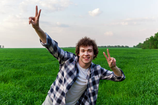 istock A man stands on green grass in a field 1496065608