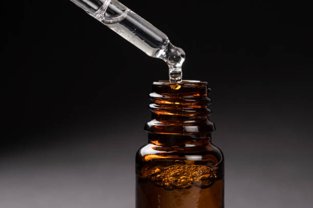 istock bottles and pipett with essential oil close up 1496065786