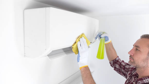 istock Service guy cleaning and maintaining air condition unit. 1496066980