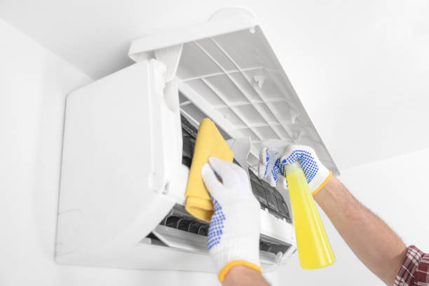 istock Service guy cleaning and maintaining air condition unit. 1496067009